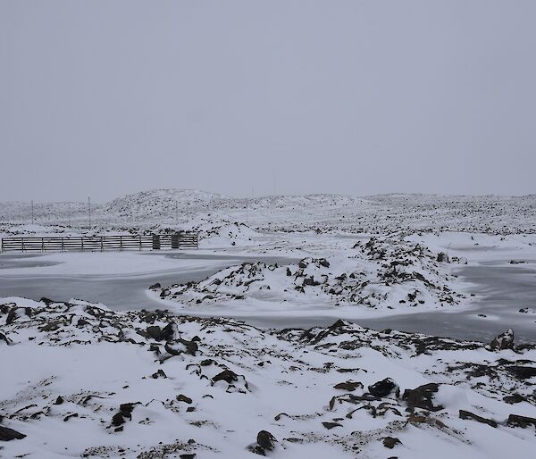 Fresh snowfall on lakes and hills surrounding the station