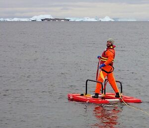 Expeditioner standing on an inflatable rescue device