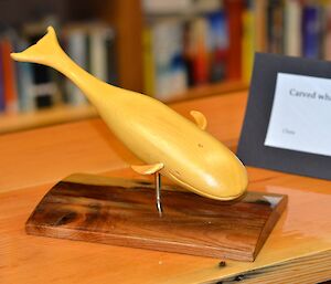 A wooden carving of a whale by a Davis expeditioner