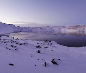 Panorama of a snowy banked lake to be sampled