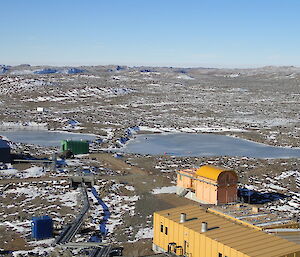 View of the lake with brown hills in the background