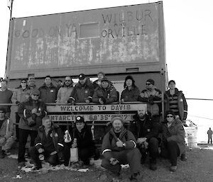 A group of Russian and Australian expeditioners ourside a shipping container