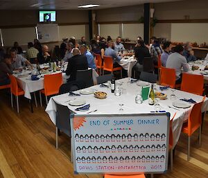 Expeditioners gather in the dining room for a celebratory dinner