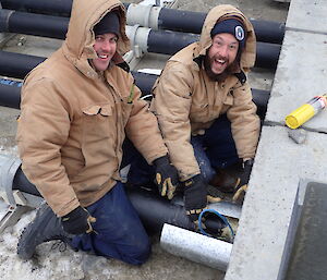Expeditioners working on pipeline
