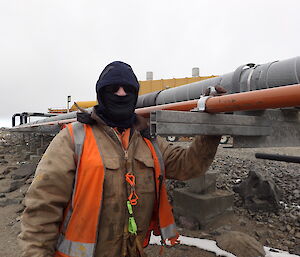 Expeditioner working on a fuel line