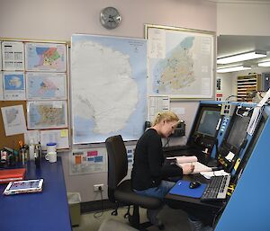 Expeditioner sitting at a communications desk