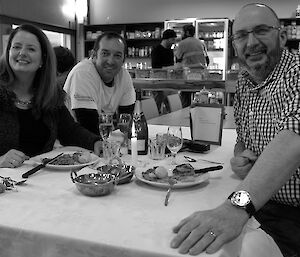 Group of expeditioners sitting at a table celebrating wedding anniversaries