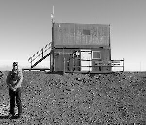 Expeditioner standing beside a helipad at Davis