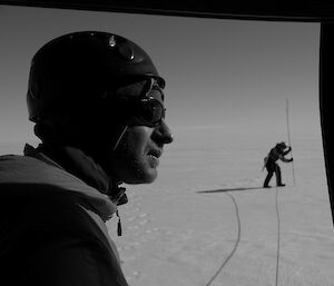 Expeditioner sitting in a helicopter