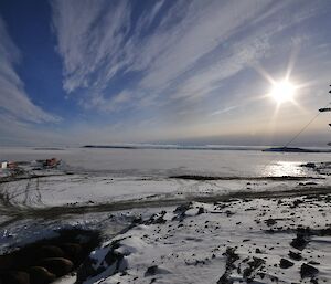 Photo of sea ice with Davis signposts in foreground