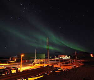 Green aurora lights up the sky above Davis station