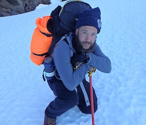 Expeditioner leaning on his hiking pole