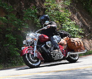 Man on a red motorcycle