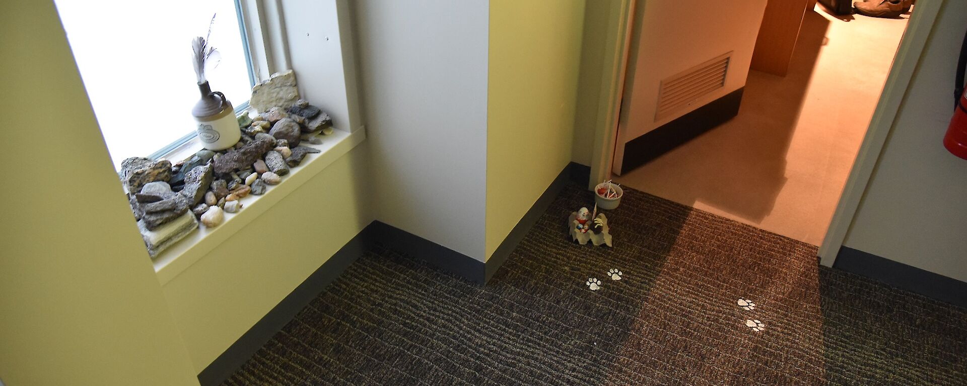 Easter bunny pawprints and chocolate eggs outside the door of an expeditioner’s room