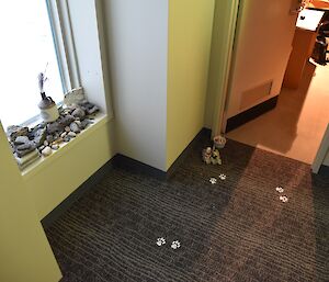 Easter bunny pawprints and chocolate eggs outside the door of an expeditioner’s room