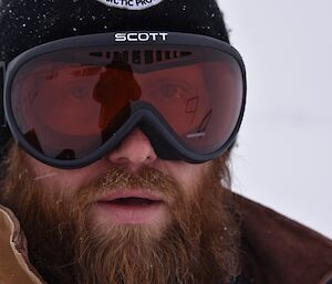 Expeditioner close up of face, beared wearing a beanie