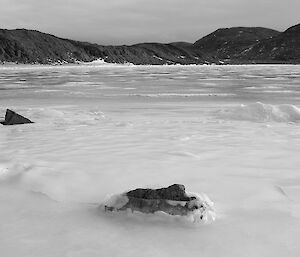 Frozen fjord and surrounding hills