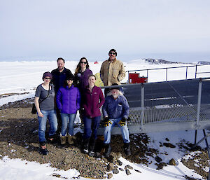 Expeditioners posing outside the MET building at Davis