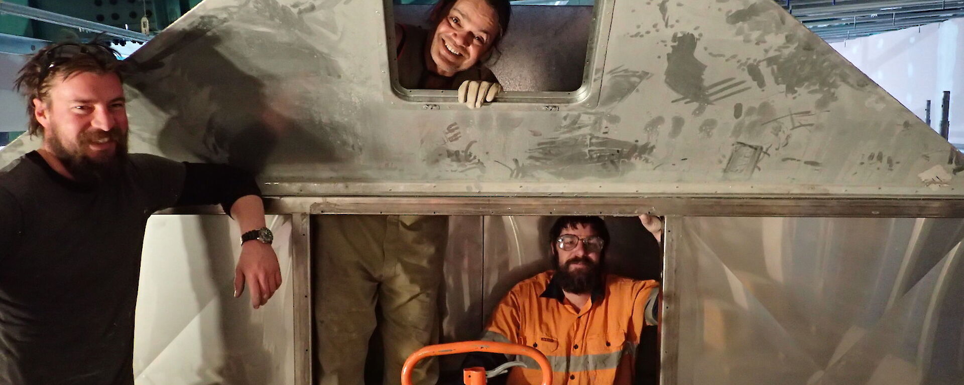 Expeditioners photographed inside a snow plenum