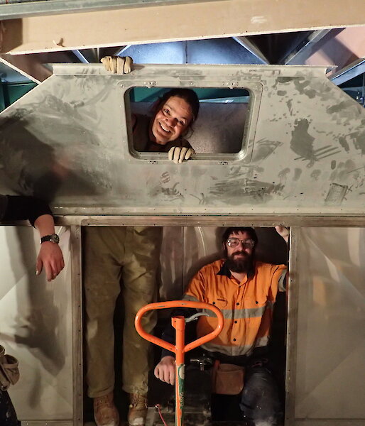 Expeditioners photographed inside a snow plenum