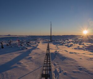 Sunrise across ice and rocky terrain