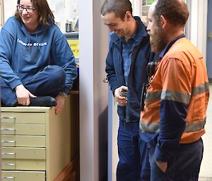 Three expeditioners relaxing at the end of the week