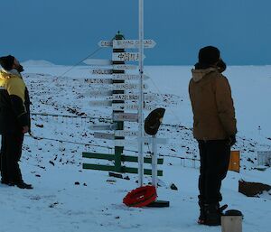 Expeditioners raising flags during the Anzac Day ceremony