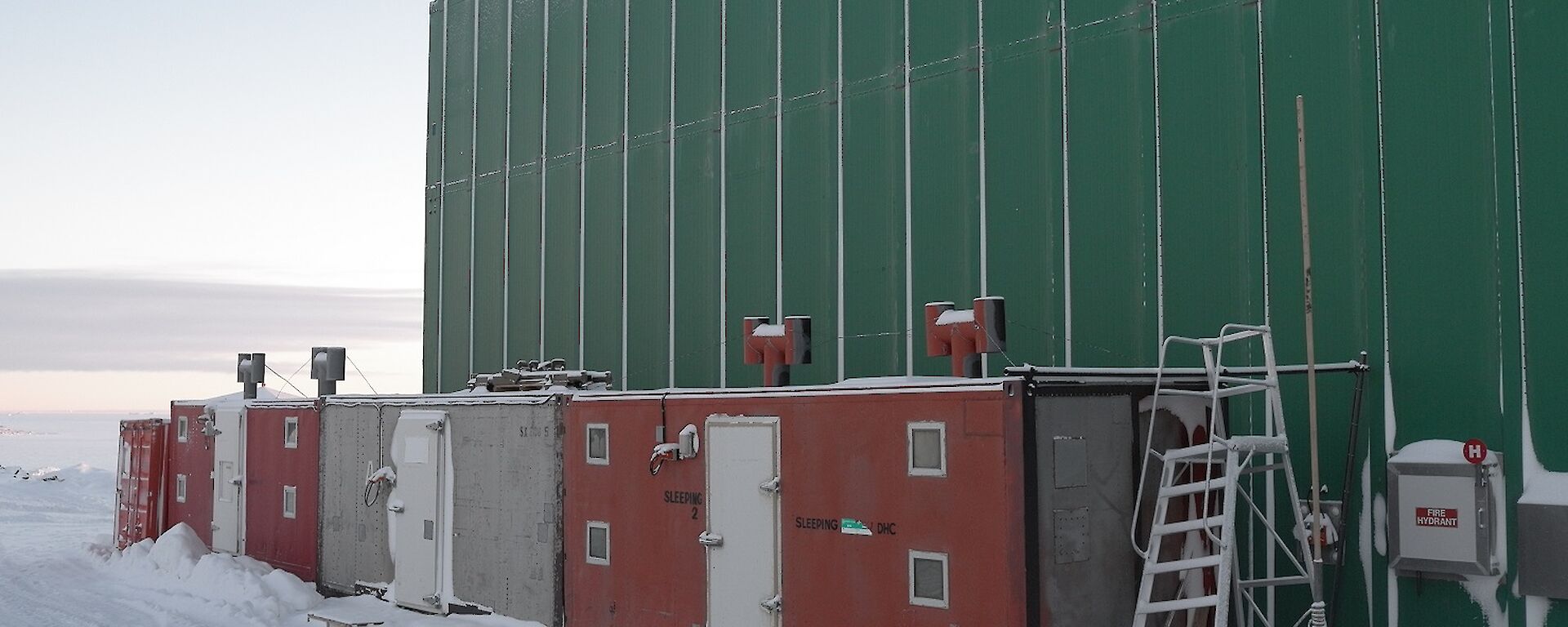Red and white 20ft containers housing Davis hydroponics set up