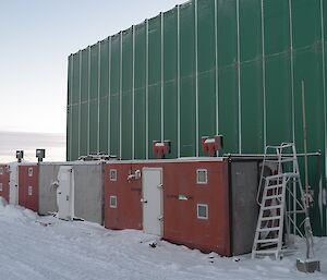 Red and white 20ft containers housing Davis hydroponics set up