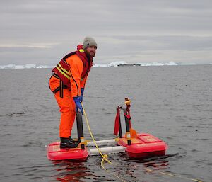 Expeditioner paddling the rescue alive platform