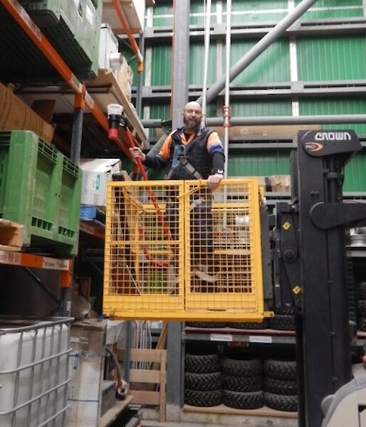 Expeditioners conducting fire checks in the green supply store