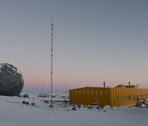 A telecommunications dome and the yellow rectangular operations building at Davis