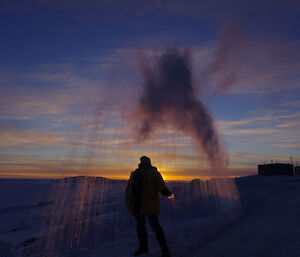 Water freezing above the head of an expeditioner as it is thrown