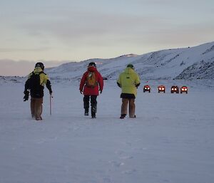 Expeditioners walking back to their quad bikes