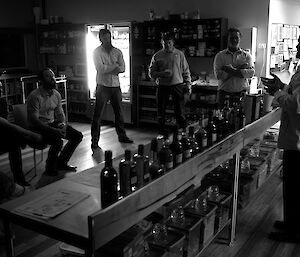 Expeditioner speaking to a gathering about his selection of whisky