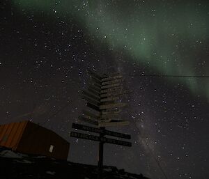 An aurora australis, green misty light suspended int the night sky over Davis