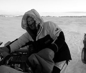 Expeditioner with his hands on the heated quad handle bars