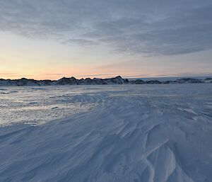 Photo of sea ice and surrounding hills in Long Fjord