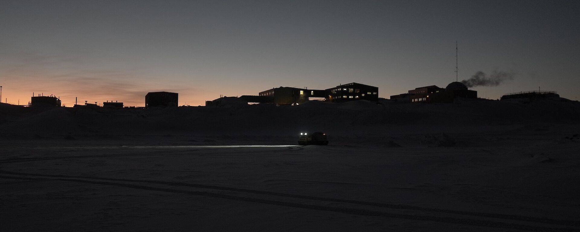 Silhouette shot of station from out on the sea ice