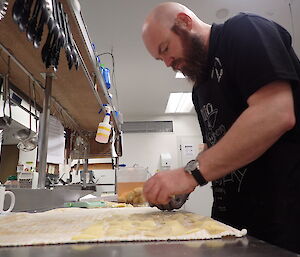 Expeditioner preparing food in the kitchen.