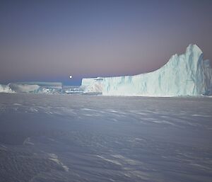 Iceberg on the return to station with moon rising