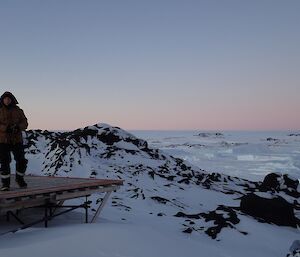 Expeditioner standing on deserted helicopter pad