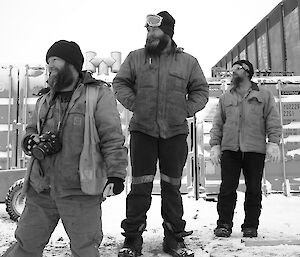 Three expeditioners watching the Hägglunds slalom action.