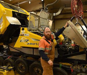 Expeditioner in the workshop, working on a vehicle.