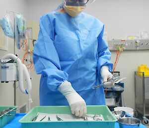 Expeditioner dressed in blue surgical scrubs