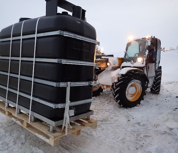 Equipment being carried on a pallet by a forklift