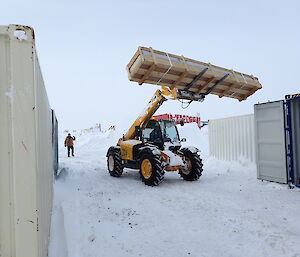 Equipment being carried on a pallet by a forklift