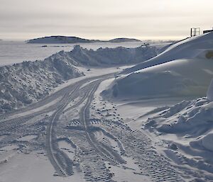 Snow cleared from roadways and piled high over buildings