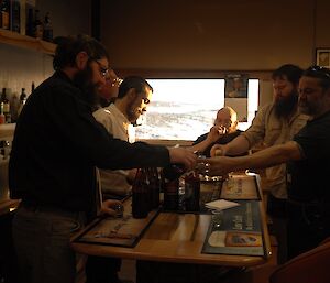 Expeditioners gathered at the bar to taste beers