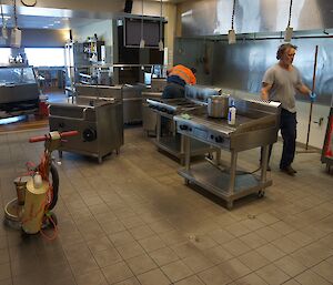 Expeditioners cleaning the floors in the kitchen